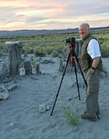 early morning portrait of Terry Gipson photographing tufas