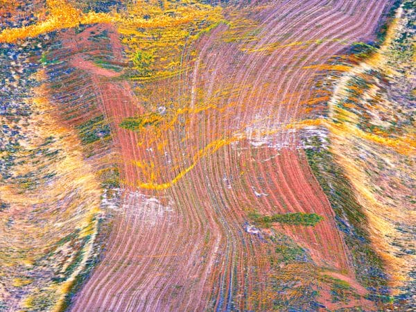 A three exposure merged photograph of a farm field seen from above
