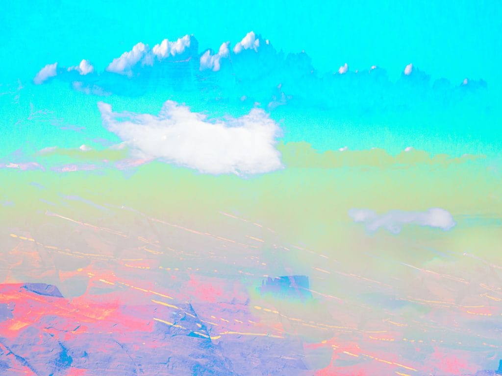 Abstract landscape with a turquoise sky, soft white clouds, and layered pastel tones transitioning from green and peach to blue and pink, with subtle linear textures suggesting distant mesas and atmospheric movement.